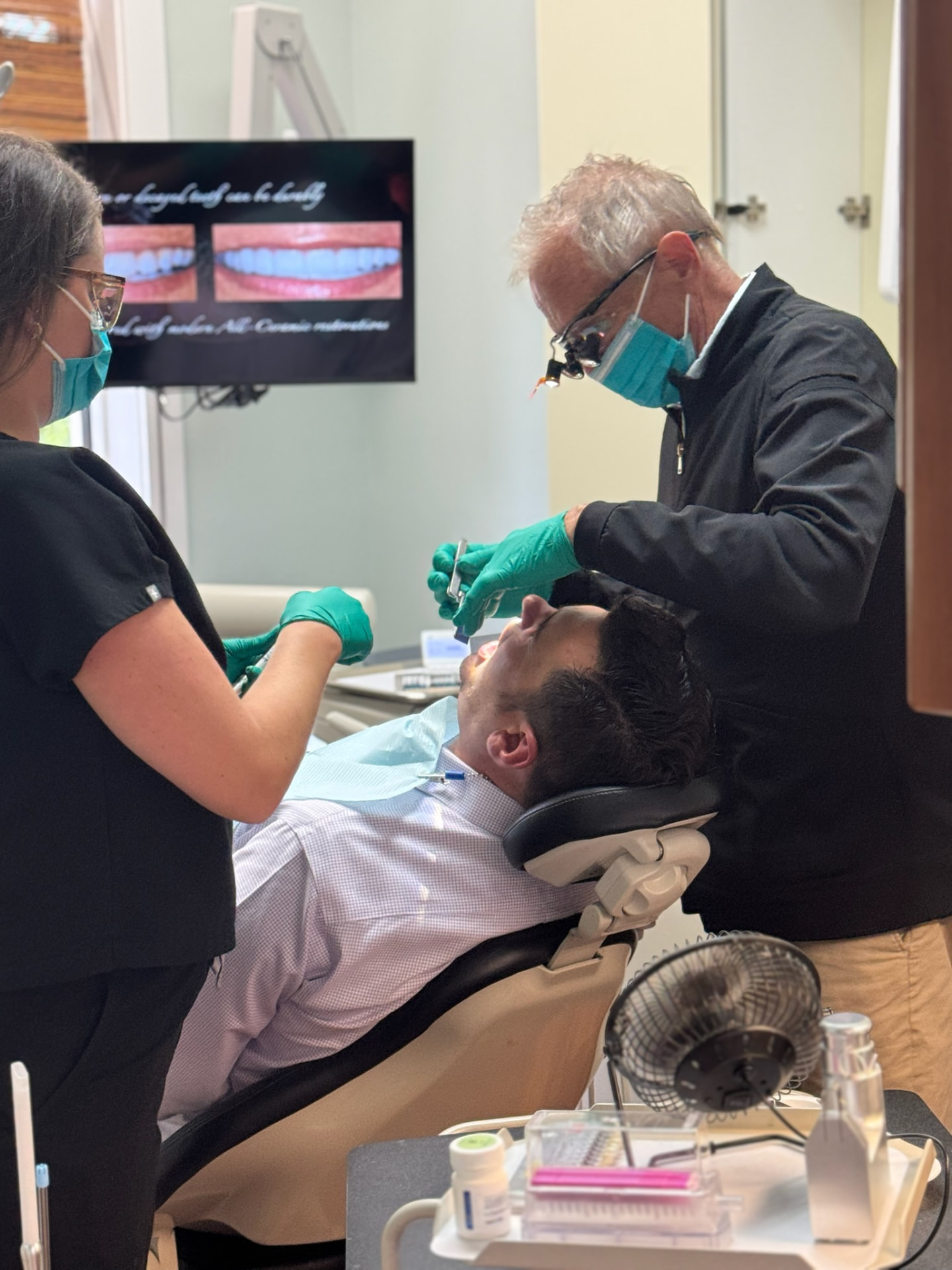 Dr. Blank and a dental assistant treating a patient in a Southern Tides operatory